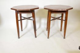 A pair of Arts and Crafts copper topped occasional tables by John Fenwick and Co, with octagonal