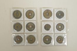 A set of twelve Chinese facsimile bronze coins/medallions, 1¼" diameter