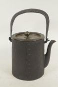 A Japanese iron teapot with loop handle and bronze cover 6" high