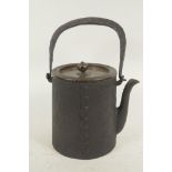 A Japanese iron teapot with loop handle and bronze cover 6" high