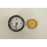 A Tiffany & Co brass clock and another similar cylinder clock, largest 2½" diameter
