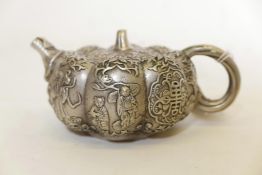 A Chinese white metal teapot in the form of a gourd, with raised decoration of Immortals, 7" x 3"