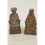 A pair of Chinese painted wooden figures of a seated emperor and empress, 5" high