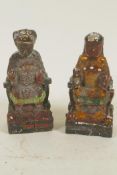 A pair of Chinese painted wooden figures of a seated emperor and empress, 5" high