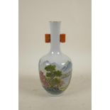 A Chinese famille verte porcelain bottle vase with two lug handles, decorated with a riverside