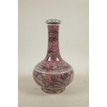 A Chinese red and white porcelain bottle vase with stylised decoration of kylin in a landscape, 6