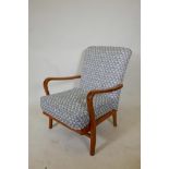 A mid century retro beechwood open armchair, 34" high