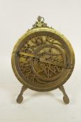 A reproduction brass astrolabe and stand, 8" diameter