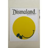 A catalogue for Banksy's Dismaland, together with Darren Cullen, 'Beheaded Queen' sticker stamp