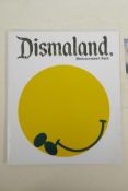 A catalogue for Banksy's Dismaland, together with Darren Cullen, 'Beheaded Queen' sticker stamp