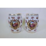 A pair of porcelain garden stools decorated in the European manner with flowers and panels of