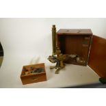 A C19th brass microscope, comes with accessories, in a fitted case, by John Robbins of London,