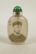 A Chinese reverse decorated glass snuff bottle with a monochrome portrait of an emperor, character