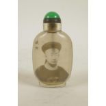 A Chinese reverse decorated glass snuff bottle with a monochrome portrait of an emperor, character