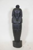 An Egyptian carved and lacquered wood figure of a pharoah, 39½" high