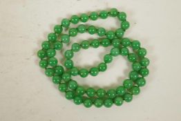 A jade bead necklace, 33" long