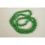 A jade bead necklace, 33" long