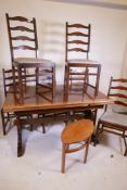 A vintage Ercol refectory style dining table with pull out leaves and six ladder back chairs, 33"