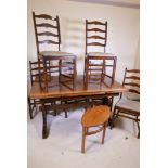 A vintage Ercol refectory style dining table with pull out leaves and six ladder back chairs, 33"