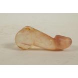 A Chinese carved agate phallic pendant, 3½" long