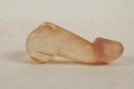 A Chinese carved agate phallic pendant, 3½" long