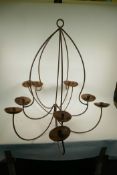 A large wrought iron ten light chandelier, 32" high, 32" wide