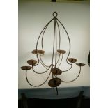 A large wrought iron ten light chandelier, 32" high, 32" wide