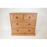 A pine chest of drawers, short over two long, on a plinth base, 38" x 17", 35" high