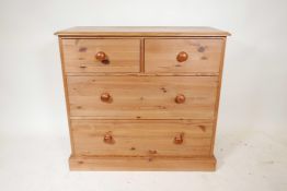 A pine chest of drawers, short over two long, on a plinth base, 38" x 17", 35" high