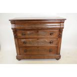 A Victorian mahogany chest, with moulded frieze drawer over three more, with carved corbels and
