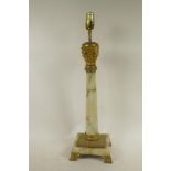 An onyx and ormolu table lamp formed as a classical column on a square base, 23" high
