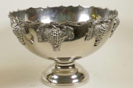 A large chrome plated pedestal punch bowl decorated with cast bunches of grapes, 10" high, 15"