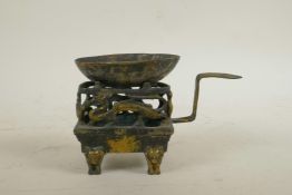 An early Chinese gilt bronze medicinal burner decorated with mythical creatures, 6½" long, 4½" high