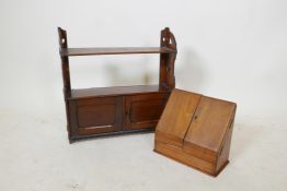 A C19th mahogany hanging shelf with two doors, and a Victorian golden oak stationery cabinet,