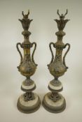 A pair of classical style gilt metal lamp bases in the form of floral decorated urns, 28" high