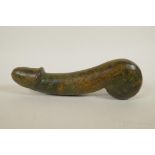 A large carved marbled green hardstone phallic ornament, 11" long