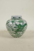 A Chinese Ming style porcelain ginger jar and cover with green enamel dragon and flaming pearl