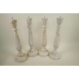 A set of four turned wood pricket candlesticks with distressed paint finish, 18" high