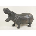 A bronzed cast metal figure of a hippopotamus, 13½" long
