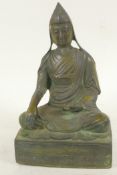 A Sino-Tibetan bronze figure of Buddha seated in meditation, 9½" high
