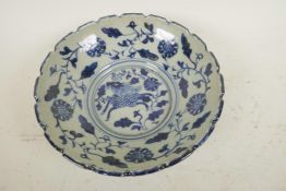 A Chinese blue and white porcelain bowl decorated with an exotic beast and lotus flowers, 6