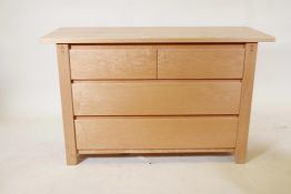 A blond maple wood chest of two short over two long drawers, 46½" x 19", 29" high