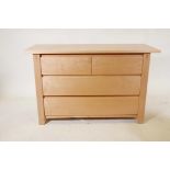 A blond maple wood chest of two short over two long drawers, 46½" x 19", 29" high