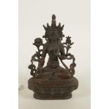 A bronze Buddhistic figure with red patination, 6¼" high