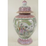 A Chinese famille rose porcelain vase and cover decorated with figures, 16" high