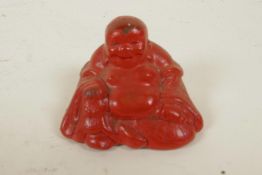 A small Cinnabar lacquer figurine of Buddha, 1¼" high