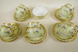 A GD & Co. Limoges porcelain part teaset painted with forget me nots on a pale yellow ground, 10 x