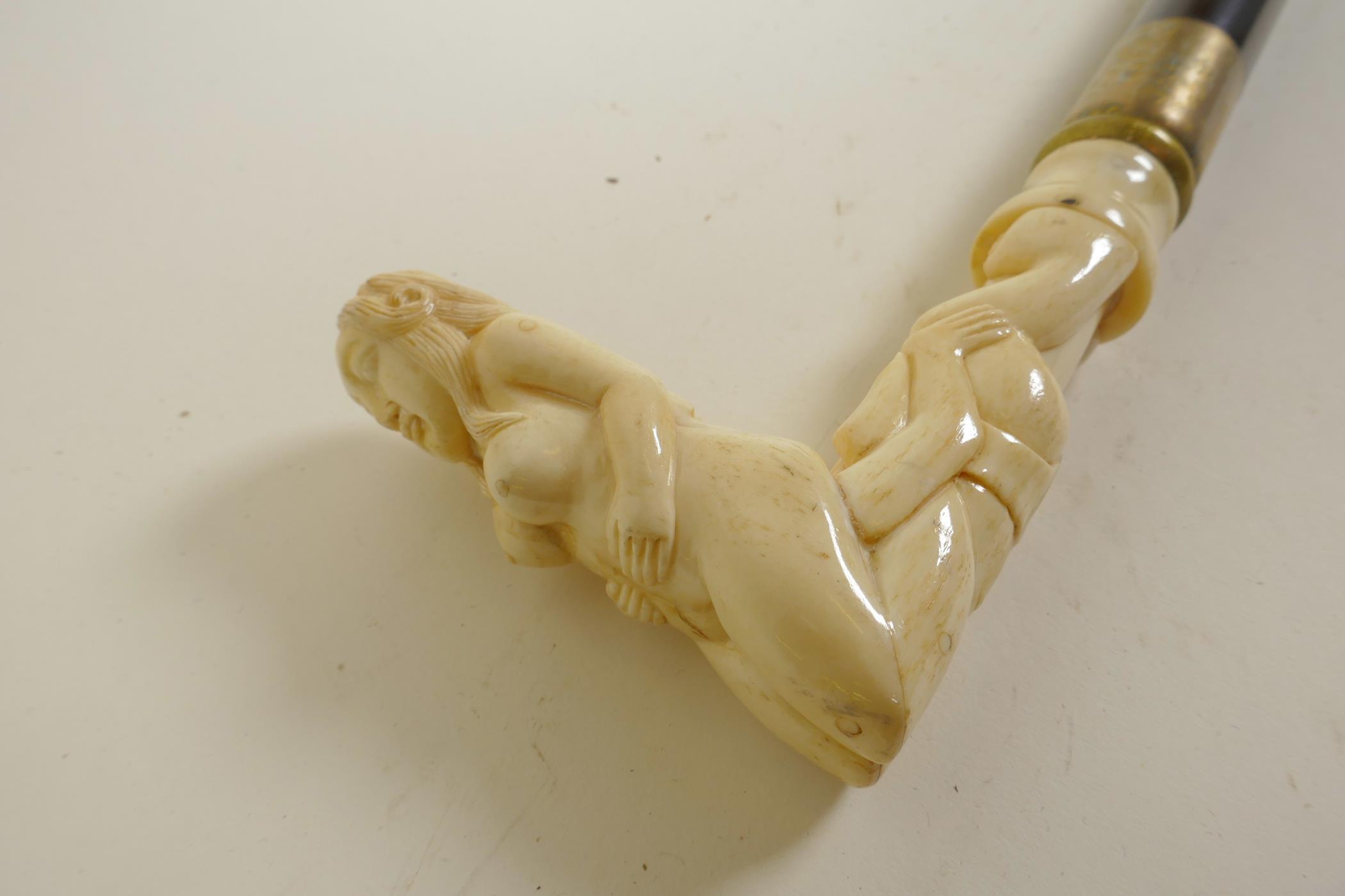 A hardwood walking stick with bone handle carved as erotic figures, 36" long - Image 4 of 4