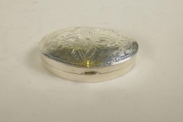 A 925 silver pill box with engraved decoration to cover, 1½" long