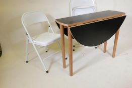 A pair of Habitat 'Macadam' folding chairs, together with a contemporary drop leaf table with a